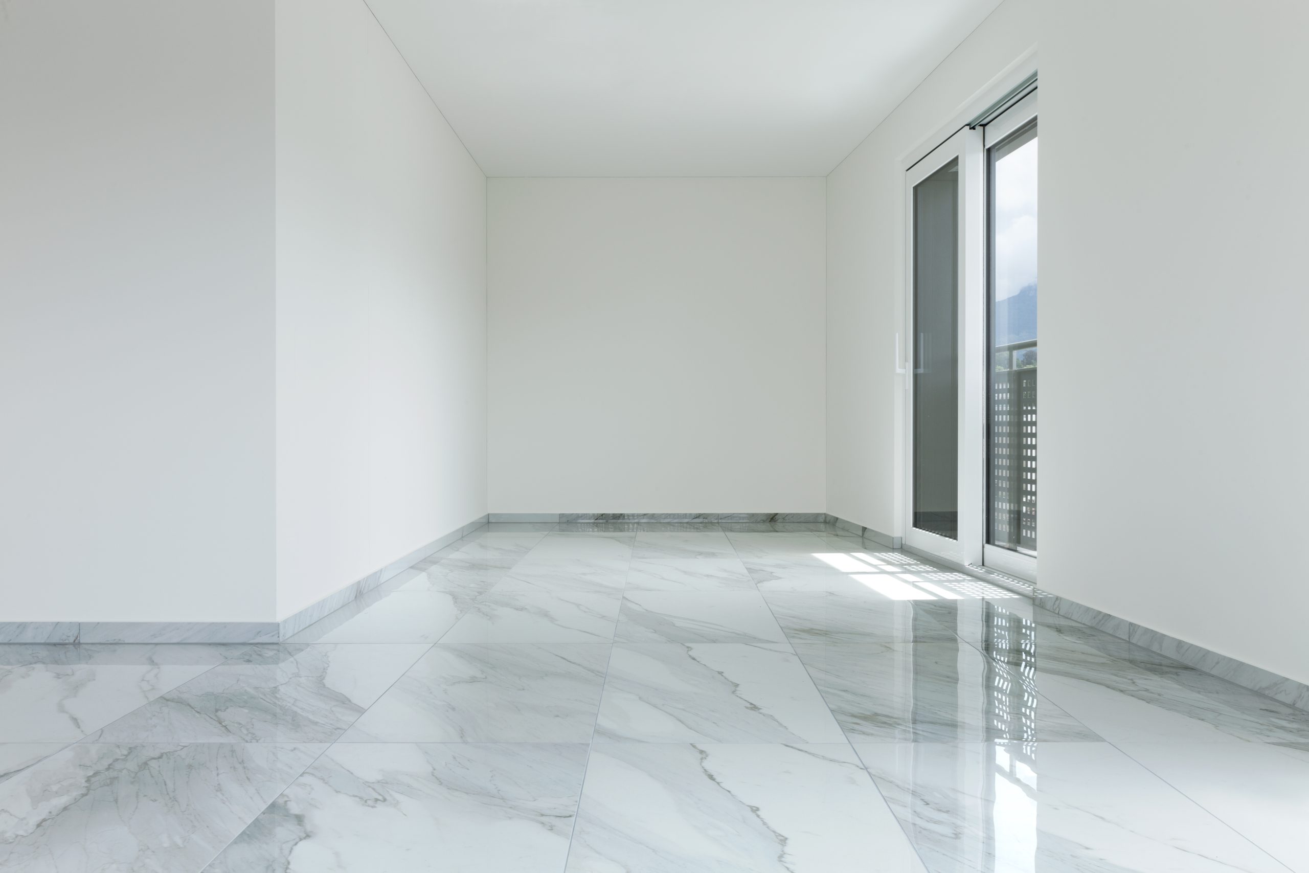 Interior of empty apartment, wide room with marble floor